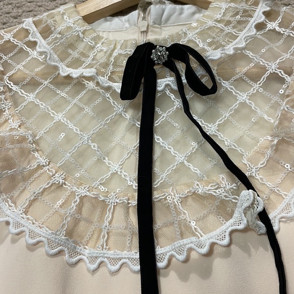 Crème coloured cocktail Dress with upper lace trim. - Picture 3 of 6